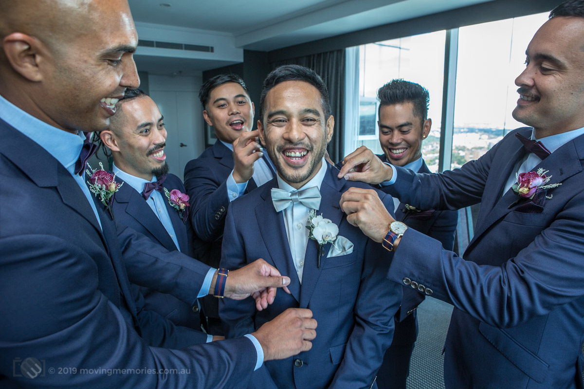 Sydney Groom Ermel getting a bit of attention from his groom's men before his wedding at the Lakes Sydney