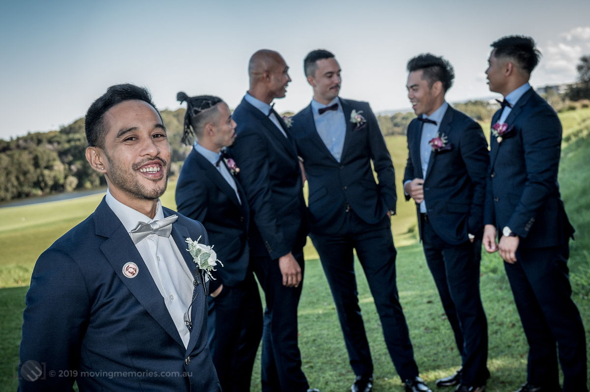 Sydney Groom Ermel, posing for a shot with his groom's men in the background just before his bride arrives at the Lakes Sydney