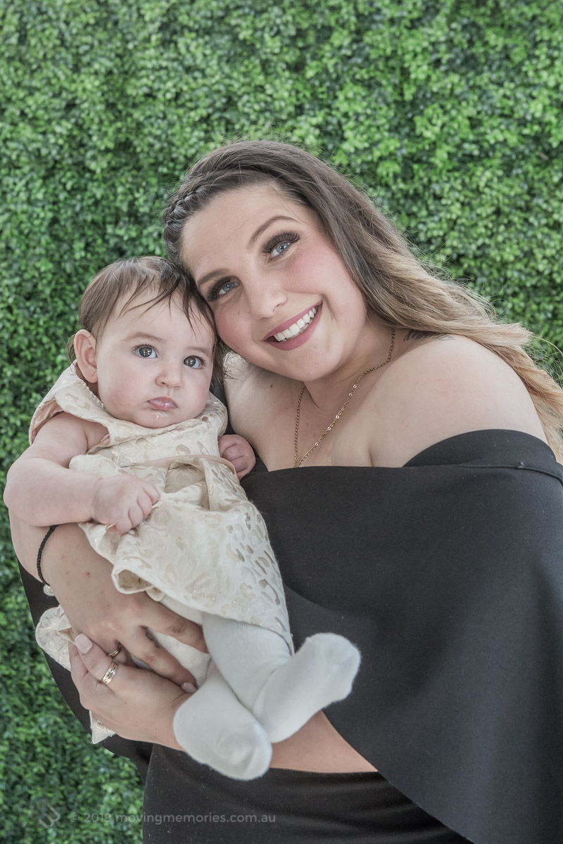 the-baby-held-in-the-arms-of-her-mother-at-home-before-the-Baby-Girl-Andrjea-Christening-at-Macedonian-Orthodox-Church-Wollongong-Panorama-House