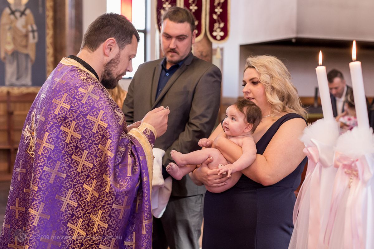 the-anointing-of-the-child-at-the-ceremony-for-Baby-Girl-Andrea-Christening-at-Macedonian-Orthodox-Church-Wollongong