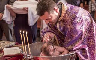 Andrjea-is-baptised-by-immersing-her-in-the-holy-water-at-the-ceremony-for-Baby-Girl-Christening-at-Macedonian-Orthodox-Church-Wollongong-600px