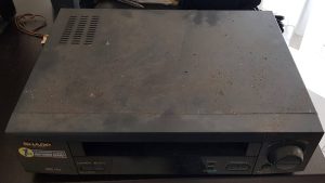VHS-video-tape-stuck-in-Sharp-VCR-top-view